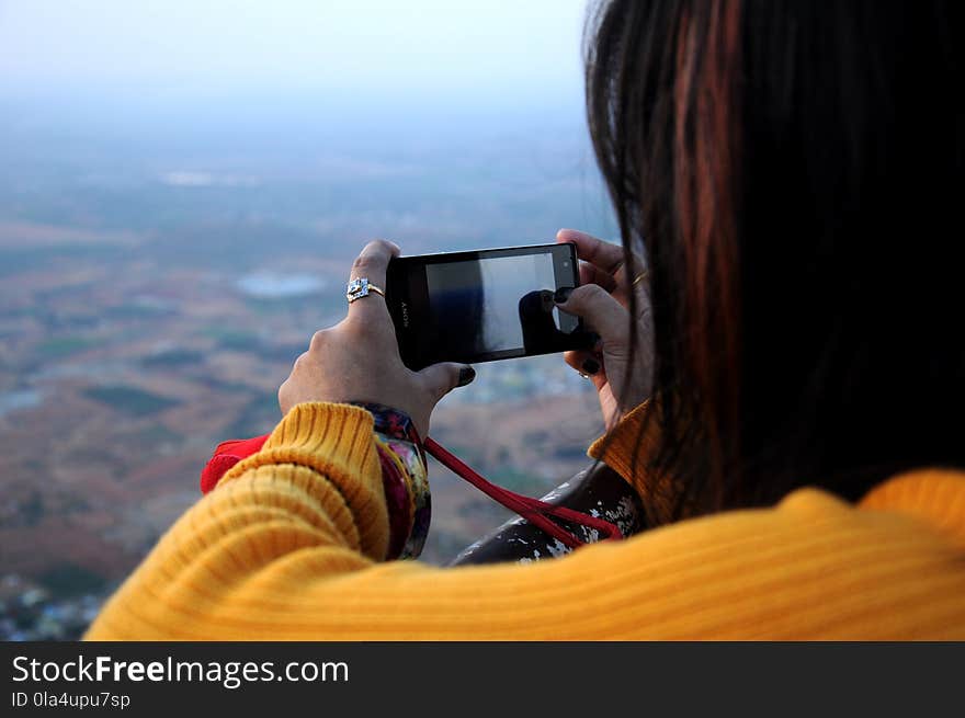 Photo of Woman Taking Picture