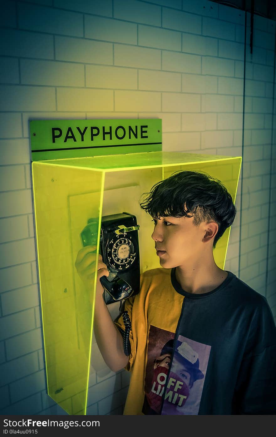 Boy holding Payphone receiver