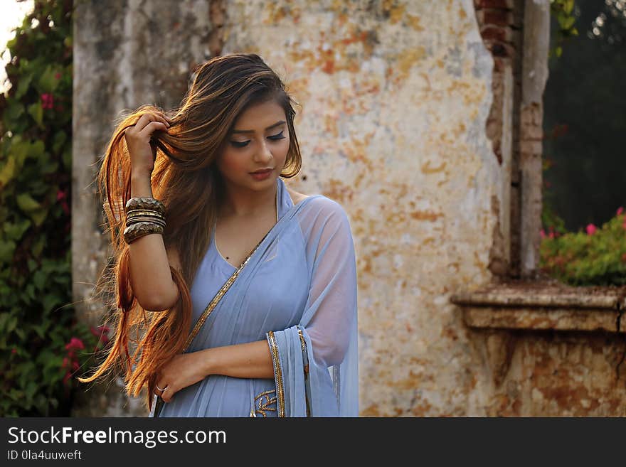 Photo of Woman Wearing Blue Dress