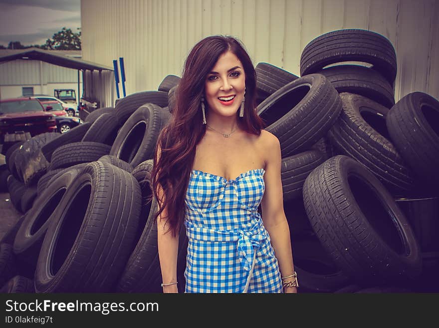 Woman Standing Behind Tires