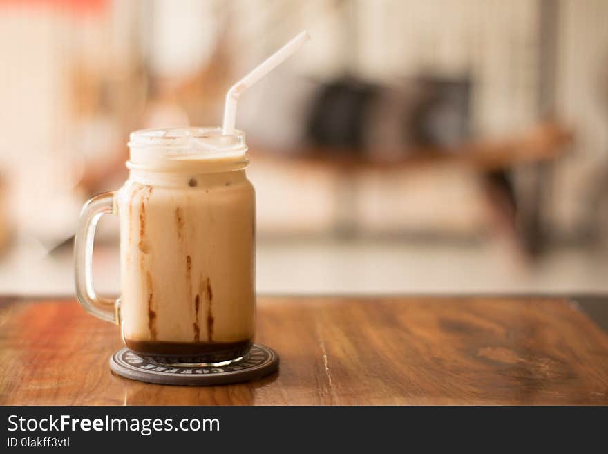 Shallow Focus Photography of Clear Glass Cup