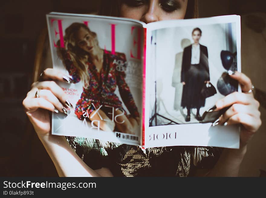 Woman Sitting on Chair While Reading