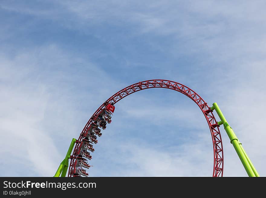 Red Roller Coaster Train on Top of Rail