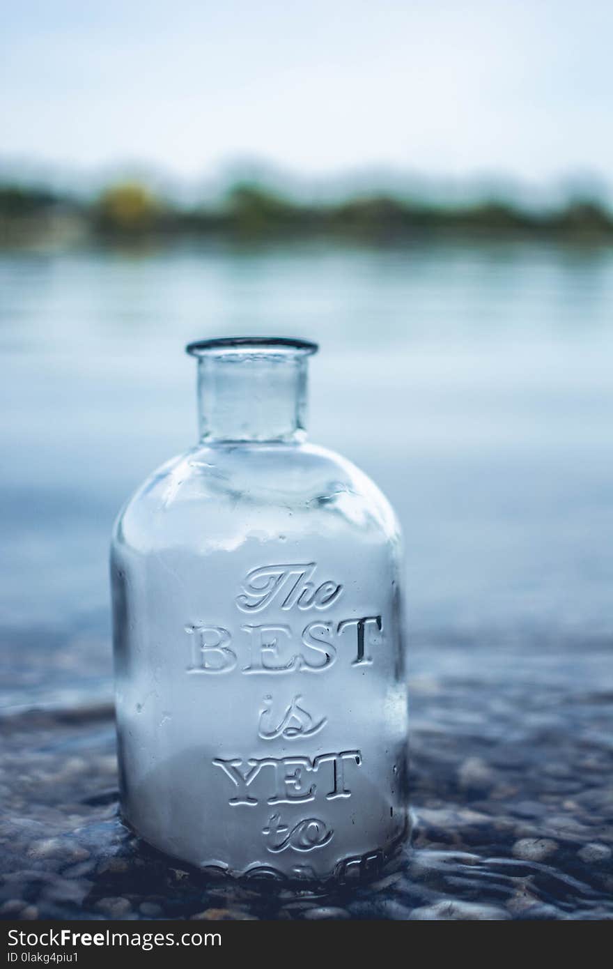 Clear Glass Jar in Body of Water