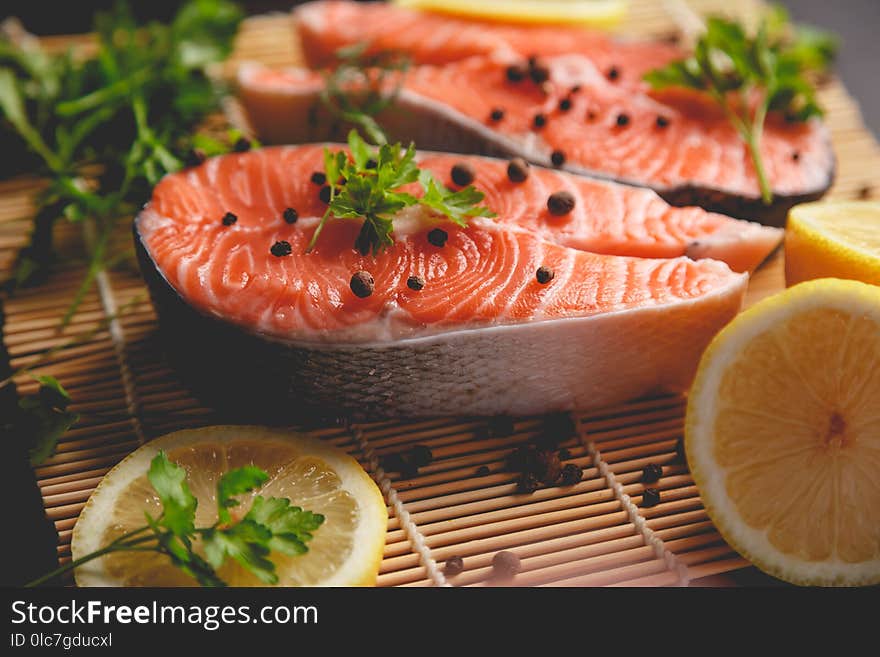 Salmon Steaks With Lemon And Spices Close Up View.