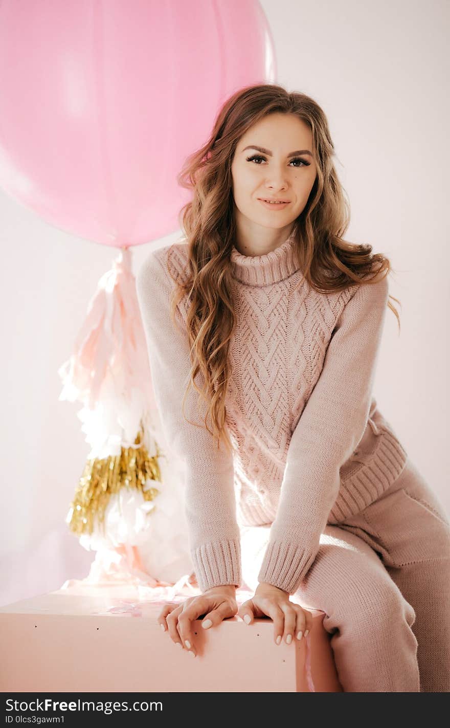 Photo of beautiful young woman with big balloons