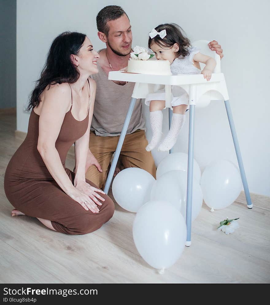 Mom and Dad together with their daughter at home on her birthdays. Mom and Dad together with their daughter at home on her birthdays