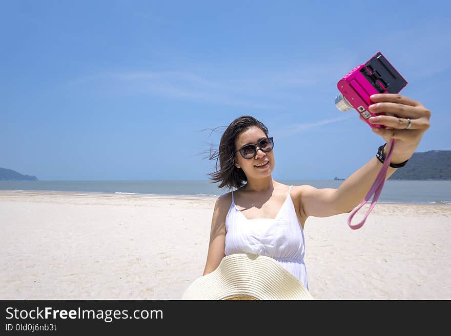 Selfie, Young Asian woman taking self portrait on the beach, Travel and touring