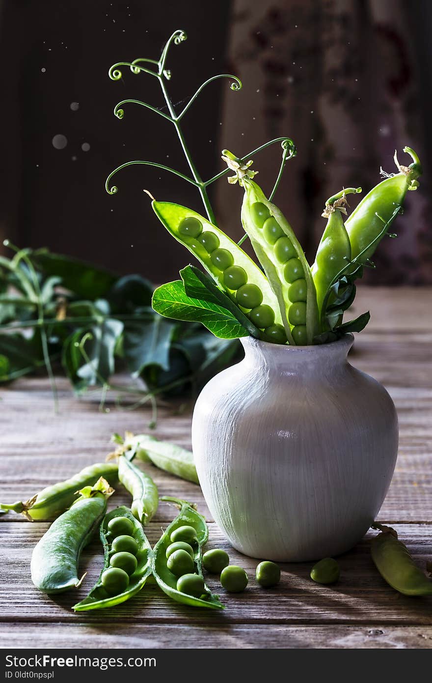 Fresh green peas on a wooden table. Fresh green peas on a wooden table.