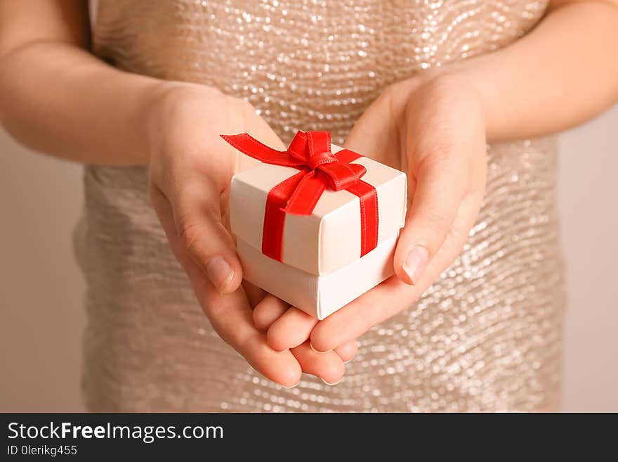 Woman holding beautiful gift box