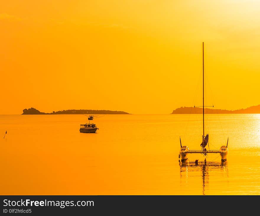 Beautiful tropical sea and ocean with sailboat or yatch