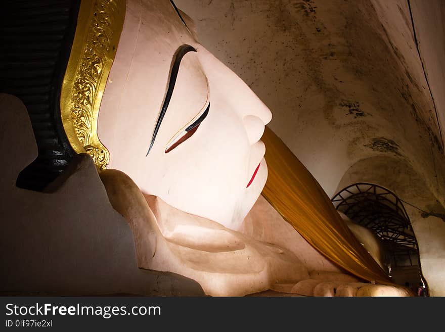 A reclining buddha in a padoga in one of the famous temple in Bagan, Myanmar. A reclining buddha in a padoga in one of the famous temple in Bagan, Myanmar