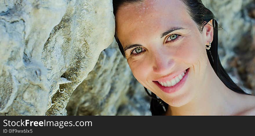 young woman on the beach, wild and beautiful