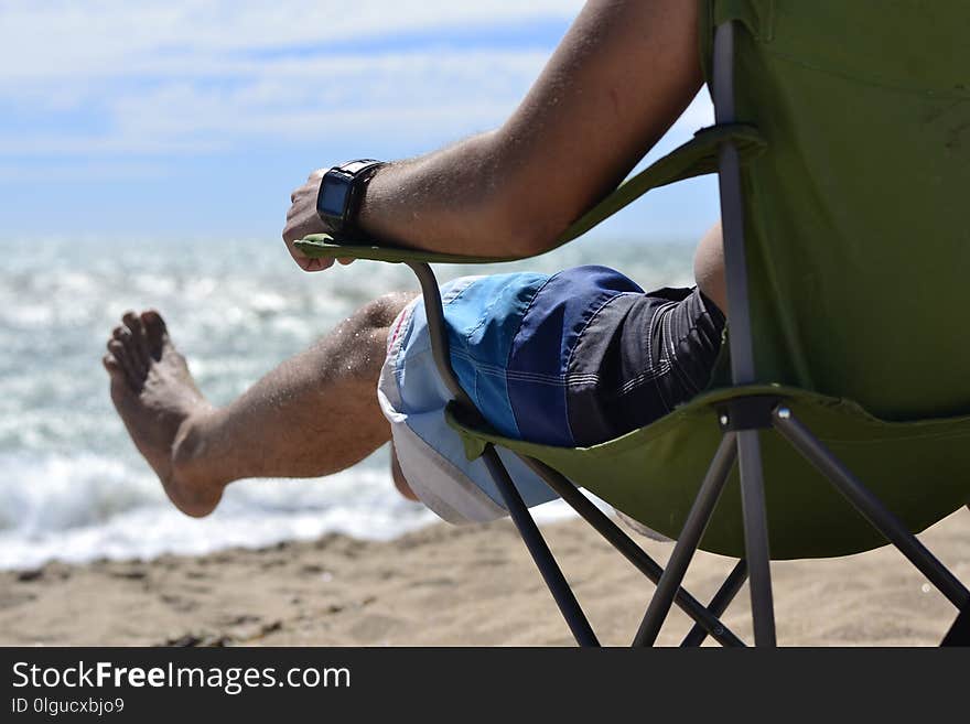 People resting on the sea in the stool