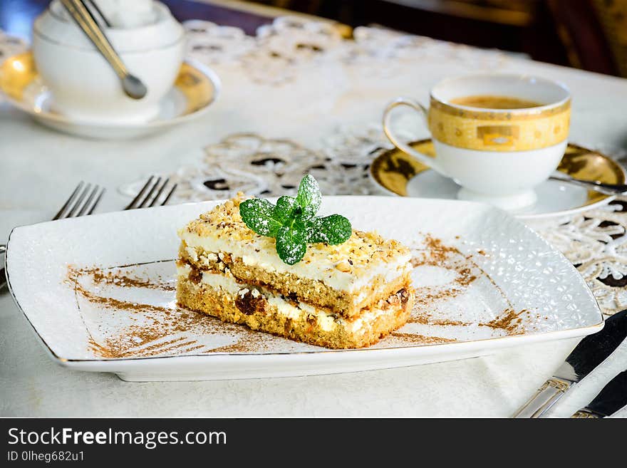 Sweet cheesecake dessert with mint in a plate