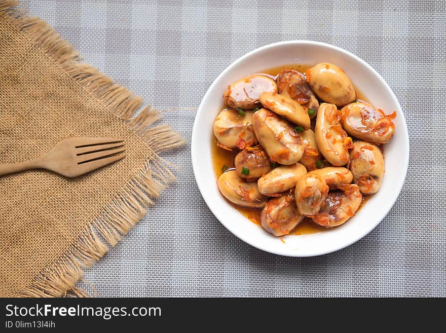 Zalacca fruit in sweet sauce on white dish