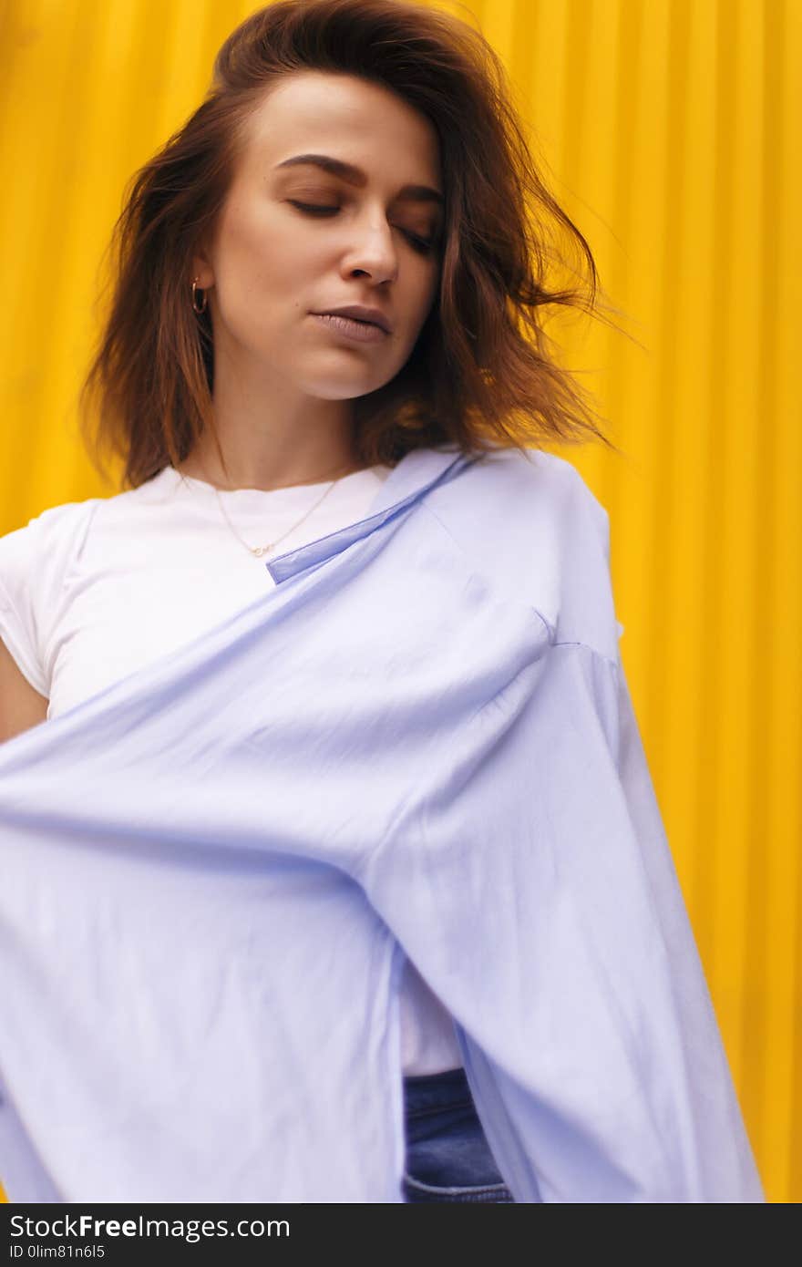 Portrait beauty woman on yellow background brunette with short hair look down and sensual.