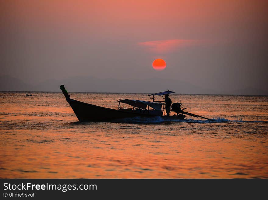 Picture of typical fisher man boat in sunset. Krabi. Thailand