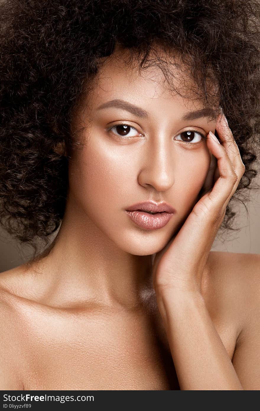 Fashion studio portrait of beautiful african american woman with perfect smooth glowing skin