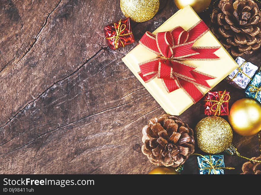 Christmas Or New Year Background With Pine Cones,gift Box On Red