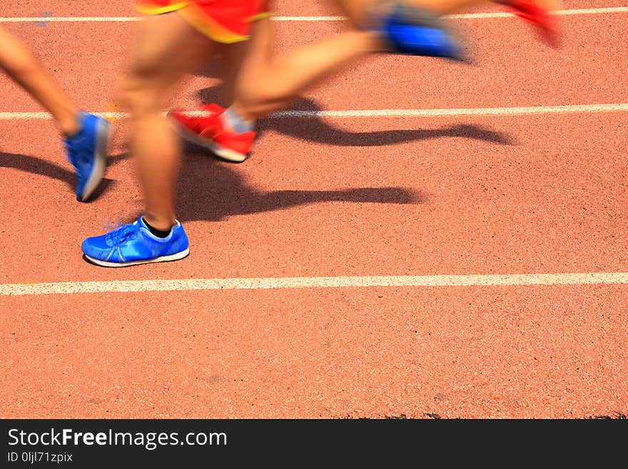 Athletes running in the playground of the runway