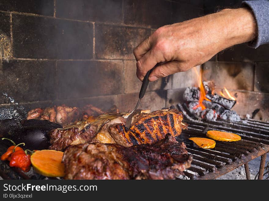 Man making barbecue for the lunch. Traditional Argentinian bbq.