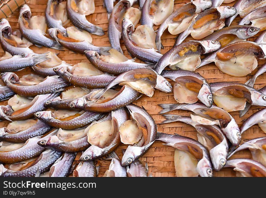 Fish Drying In The Sun On Bamboo Basket