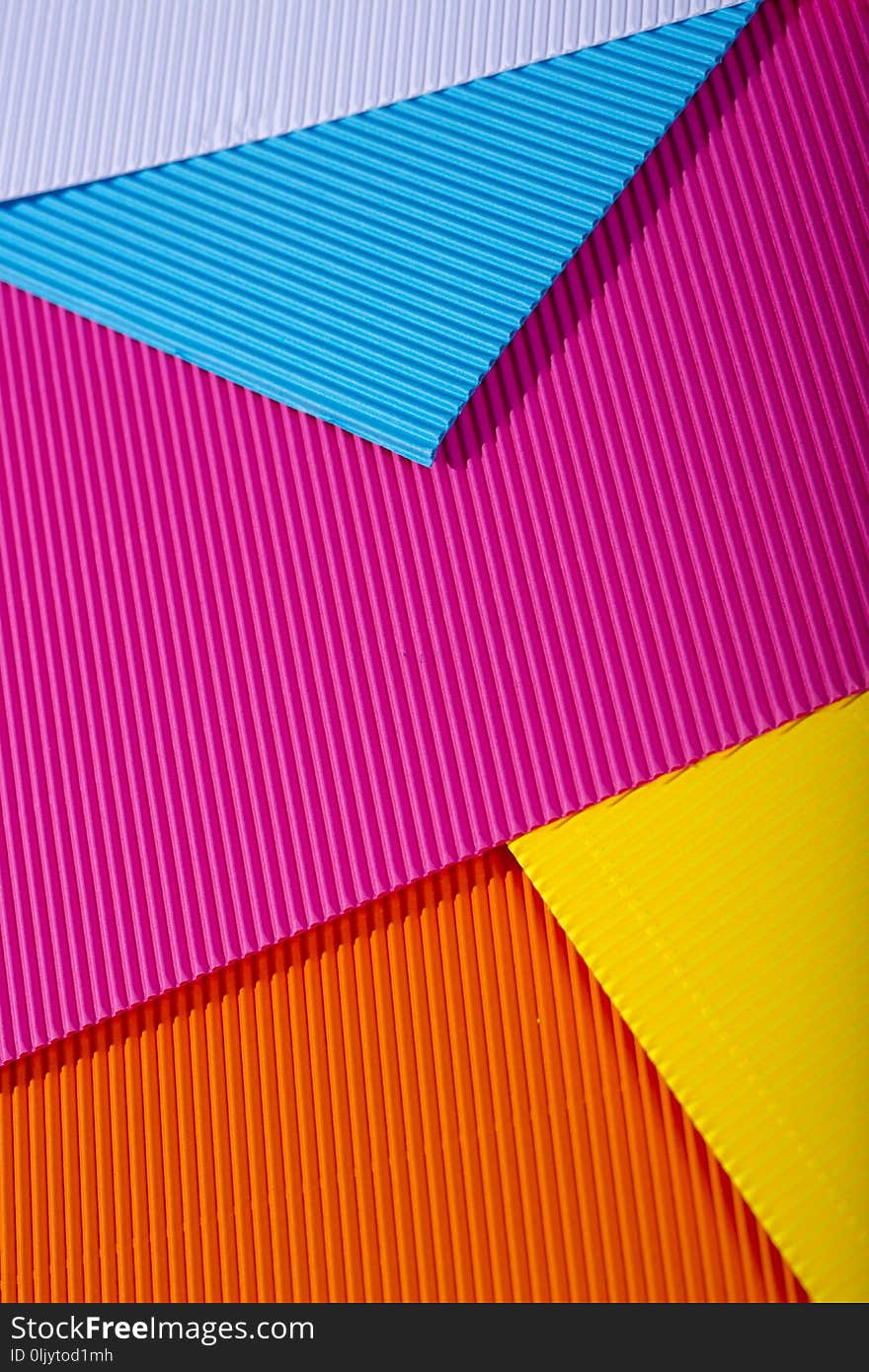 Abstract background of sheets of colored paper