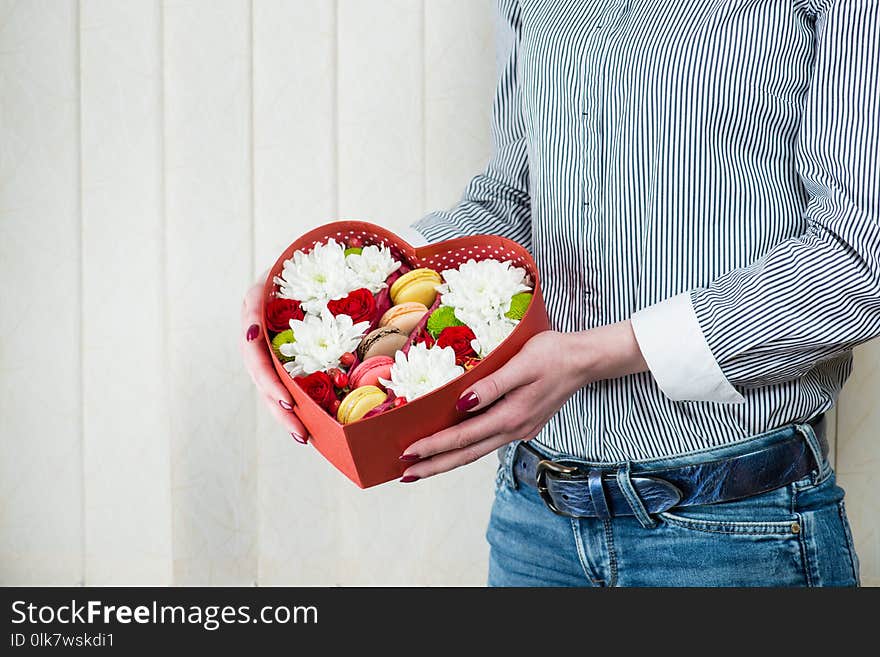 Red Box-heart With Flowers And Macaroons In Female Hands Close-u