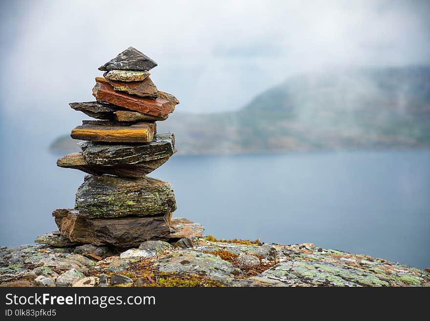 Pyramid Of Rocks Stones on mountain background, Norway