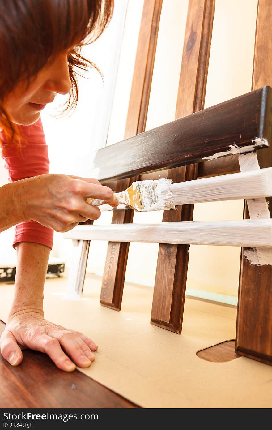 Person Renovating Wooden Hanger