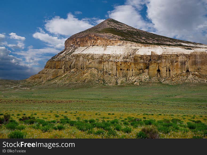 West Kazakhstan. In the boundless steppe there is a lonely mountain complex Shirkala, which from a distance looks like a Yurt. West Kazakhstan. In the boundless steppe there is a lonely mountain complex Shirkala, which from a distance looks like a Yurt.