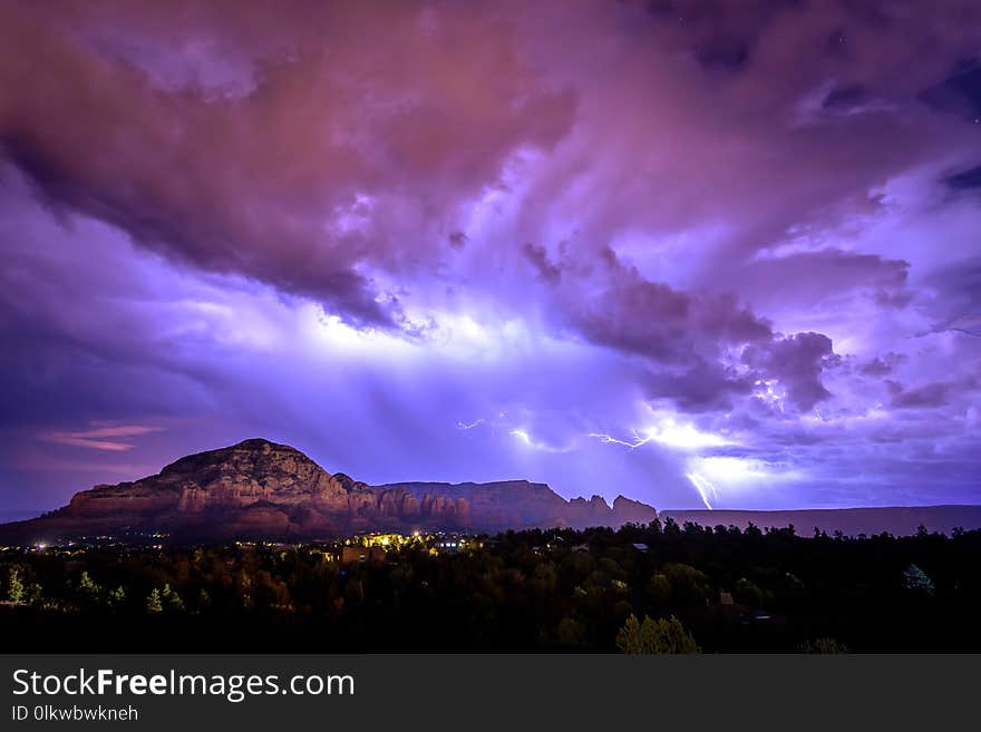 A summer monsoon in Sedona Arizona brings large lightning strikes across the sky. A summer monsoon in Sedona Arizona brings large lightning strikes across the sky