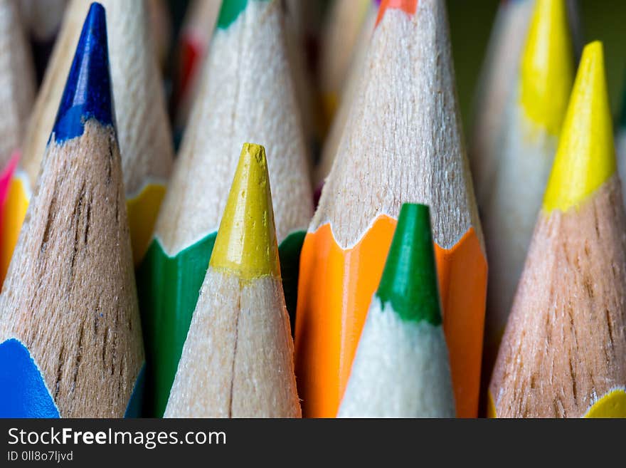 Nibs of sharpened colored pencils