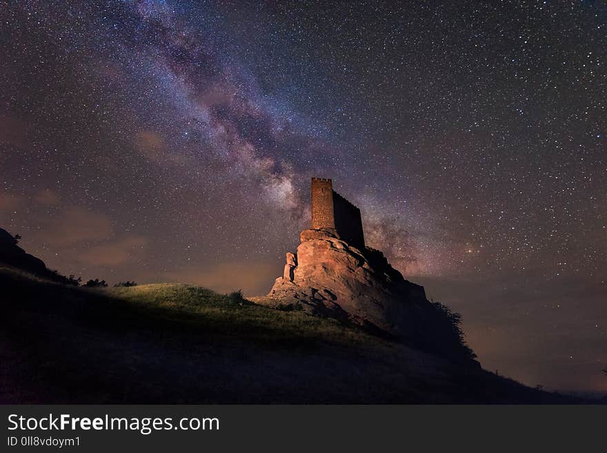 Milky way over Zafra castle in Guadalajara, Spain .