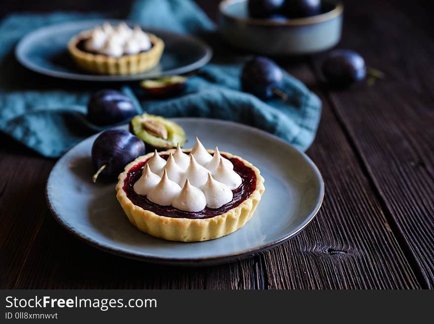 Delicious plum tartlets with meringue on top. Delicious plum tartlets with meringue on top