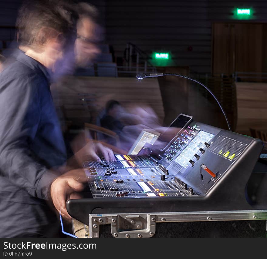 Music, technology, people and equipment concept - hands using mixing console in sound recording studio. Music, technology, people and equipment concept - hands using mixing console in sound recording studio