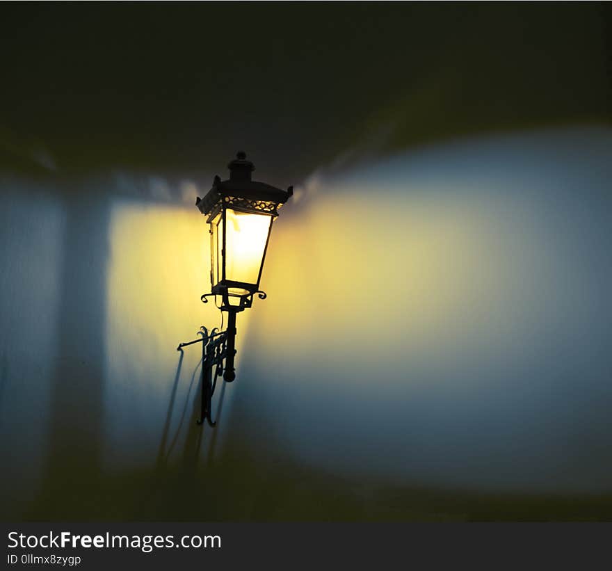 Decorative street lamps. Shadow and light on the wall. Soft focus.