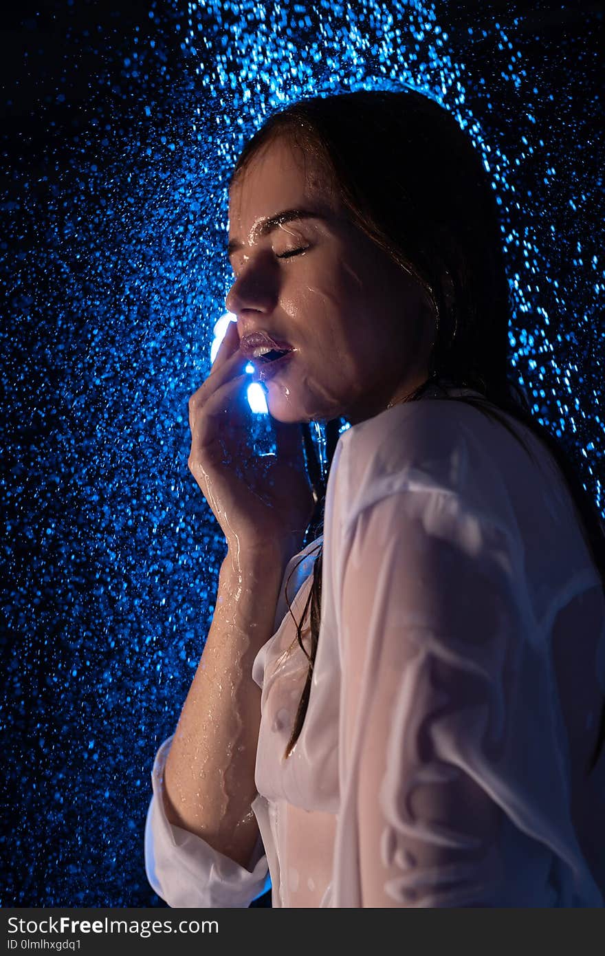 Young pretty girl in wet shirt in shower view