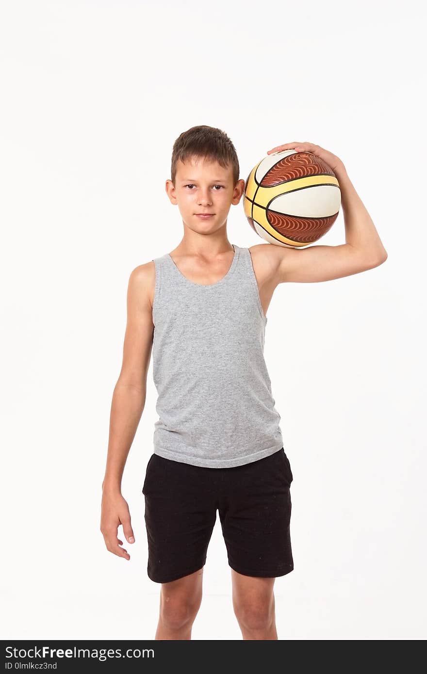 Teenager with a basketball on a white background.