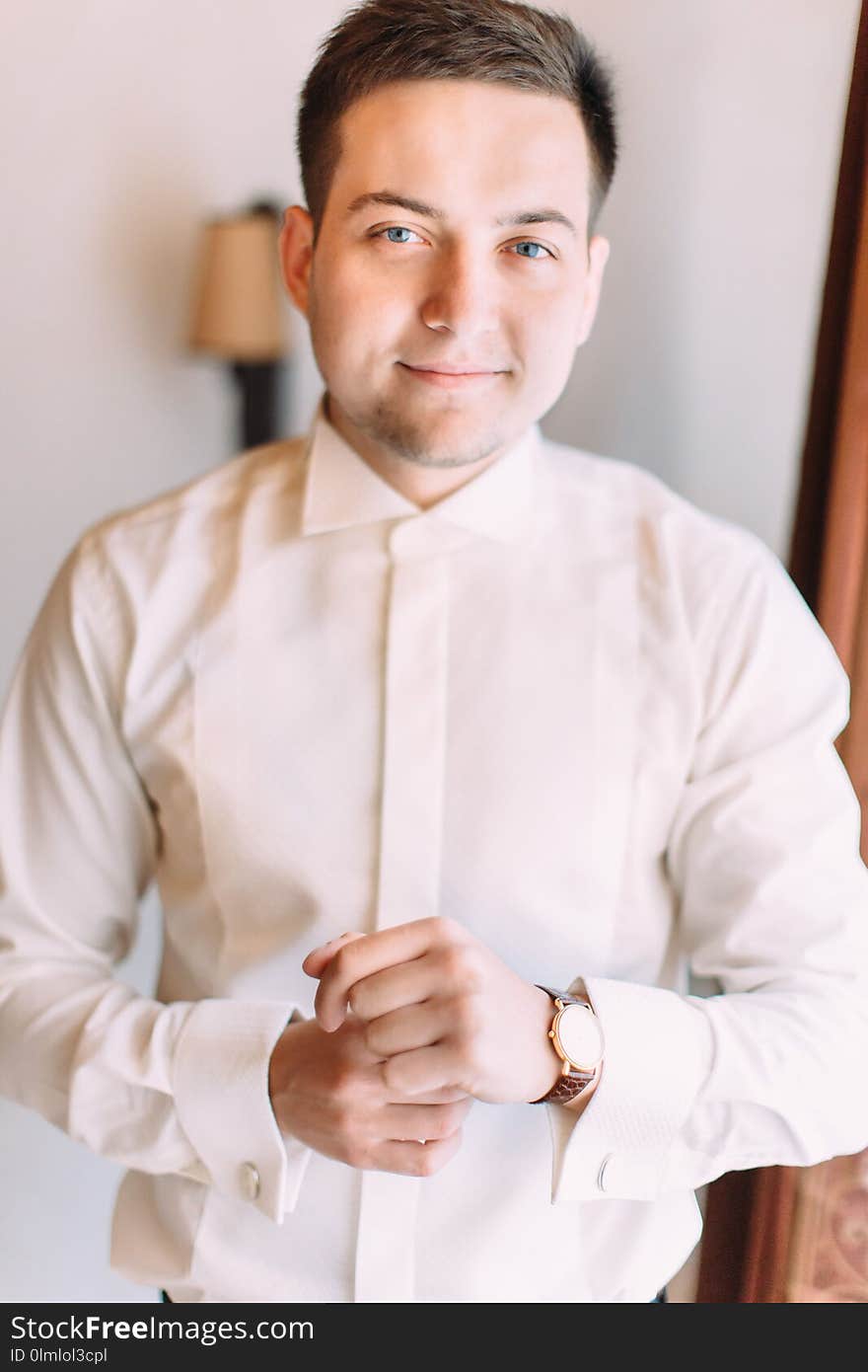 Handsome smiling groom. Half-length portrait.