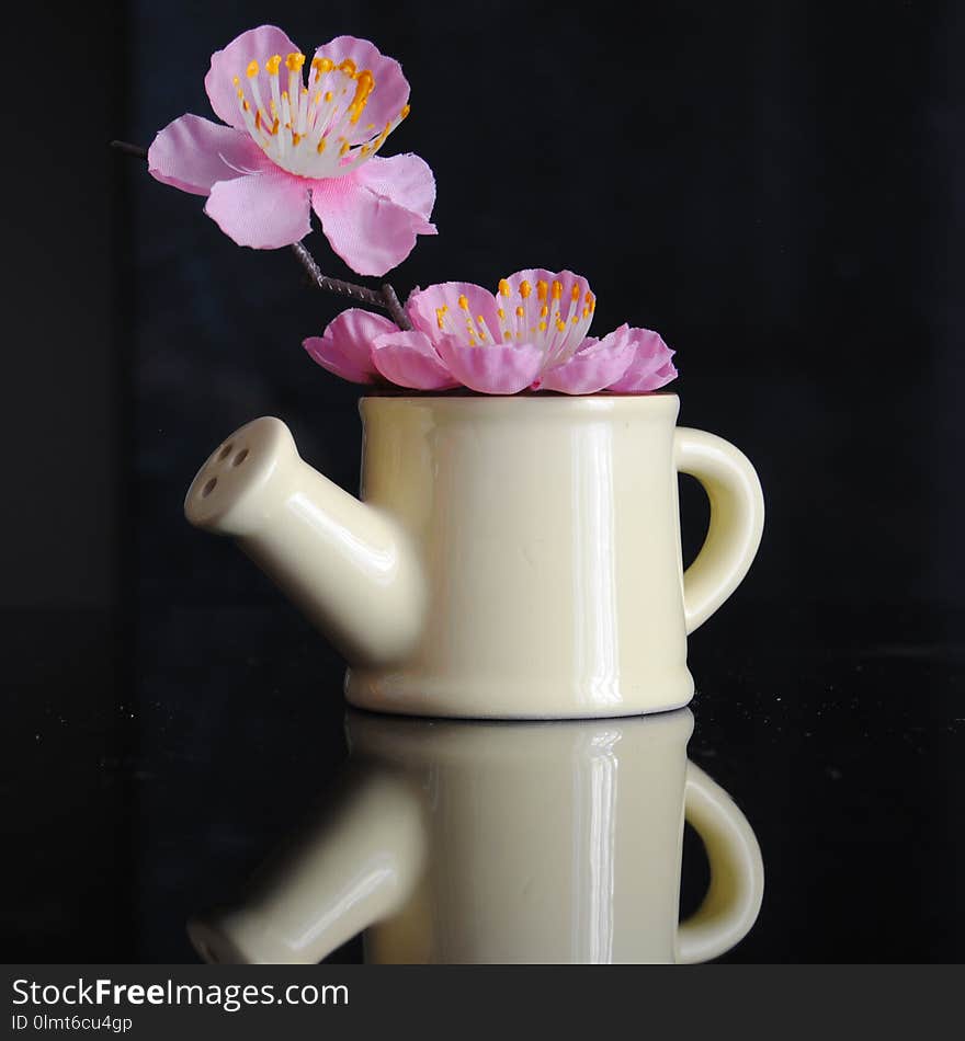 Porcelain object and branch inside, it`s a miniature. summer and fresh decoration. Porcelain object and branch inside, it`s a miniature. summer and fresh decoration