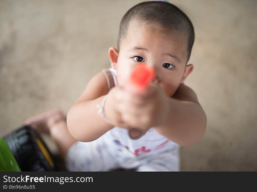 A Young Child Offer His Toy To Someone