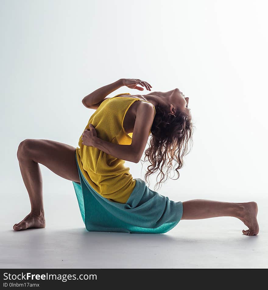 Beuatiful female dancer. Studio background.