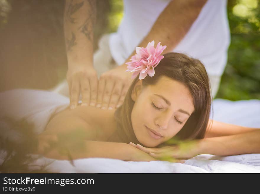 Image of brunette women enjoy in massage at nature. Close up.