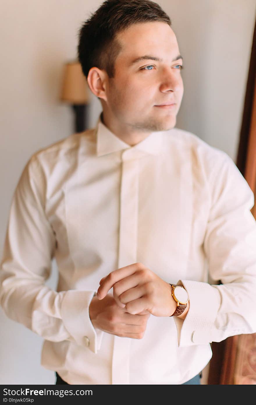 Half-length Portrait Of The Handsome Groom Looking Through The Window.