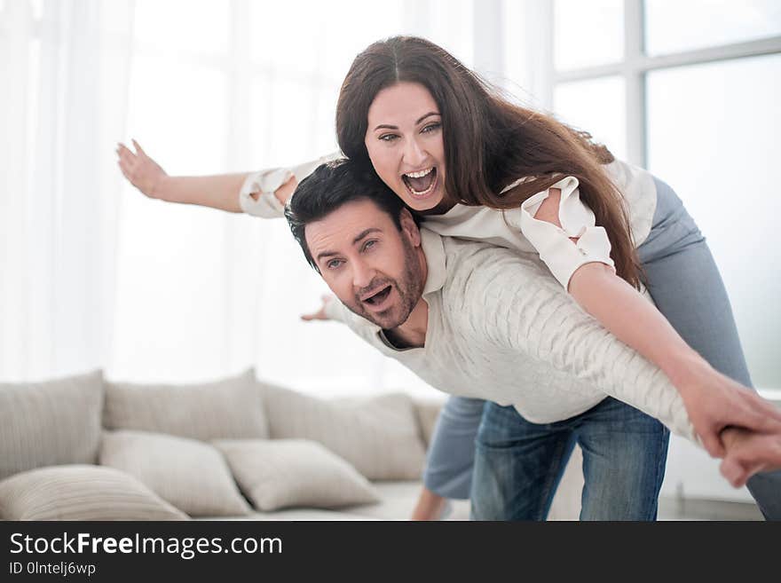 Happy couple resting in a spacious living room.photo with copy space