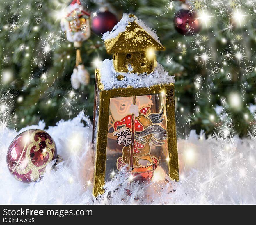 New Year`s, Christmas still life. Christmas handmade decorated lantern with a picture of fairy-tale Baba Yaga on the glass. Fir-tree background with lights. Horizontal