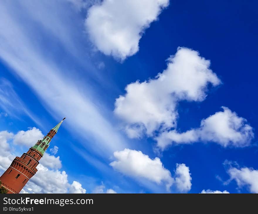 Blue sky background with Moscow Kremlin tower in left corner.