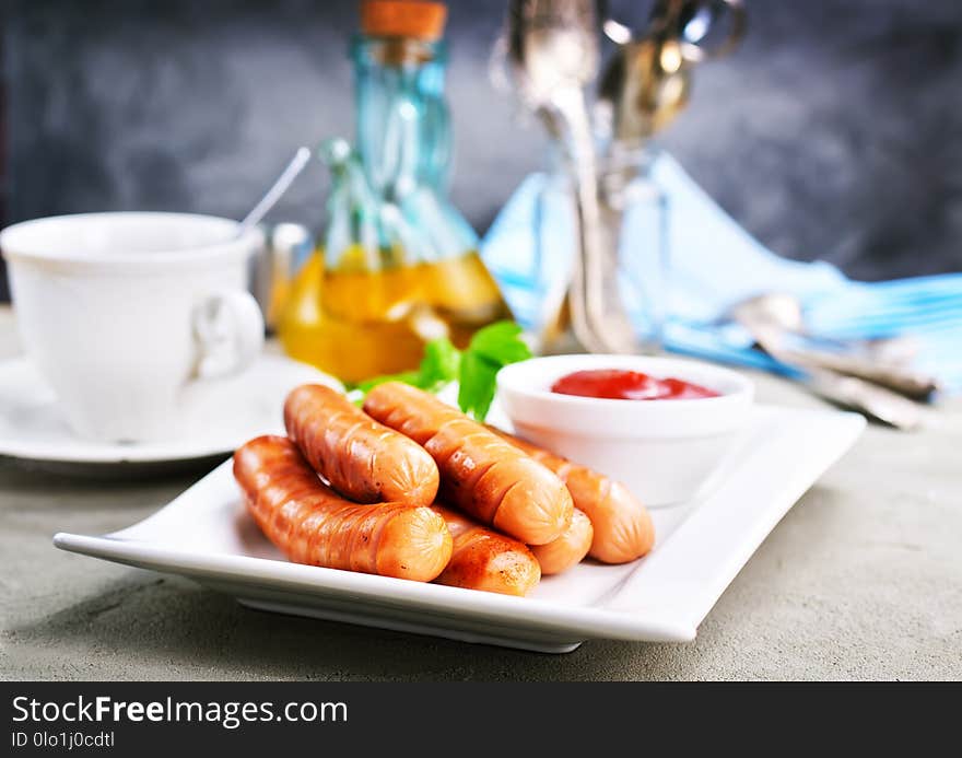 Fried sausages, sausages on white plate, stock photo